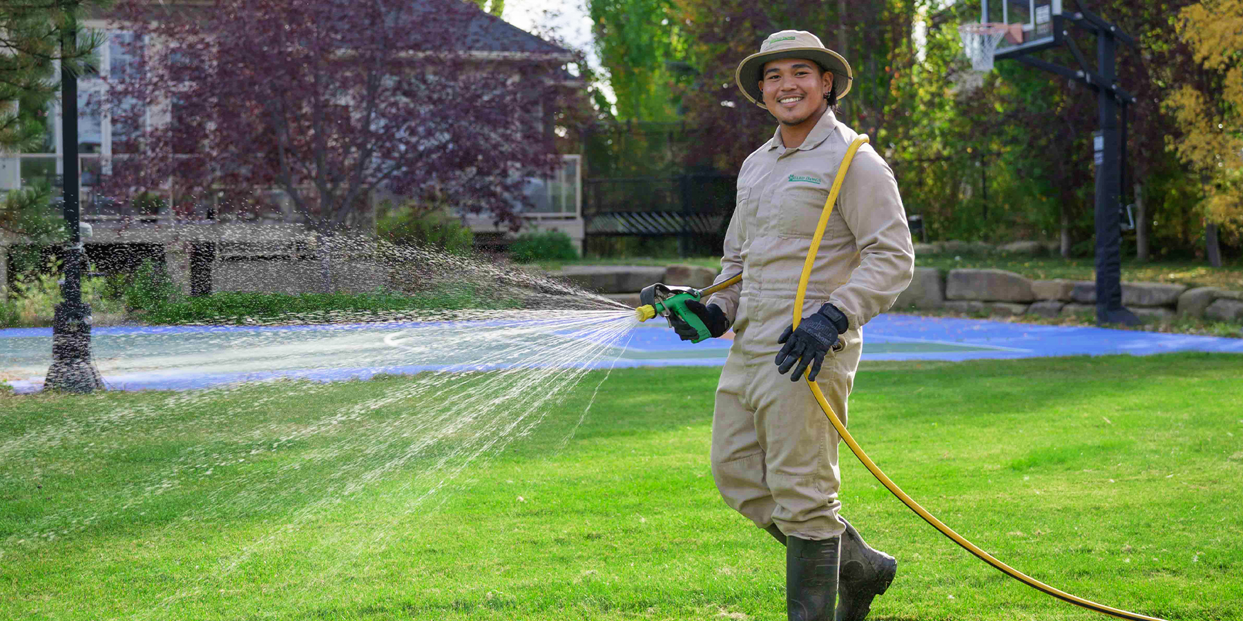 Yard Dawgs lawn care technician at work